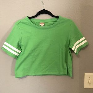 Green crop top with white strips on sleeves